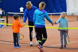 Kids playing with adults at Halton Tennis Centre